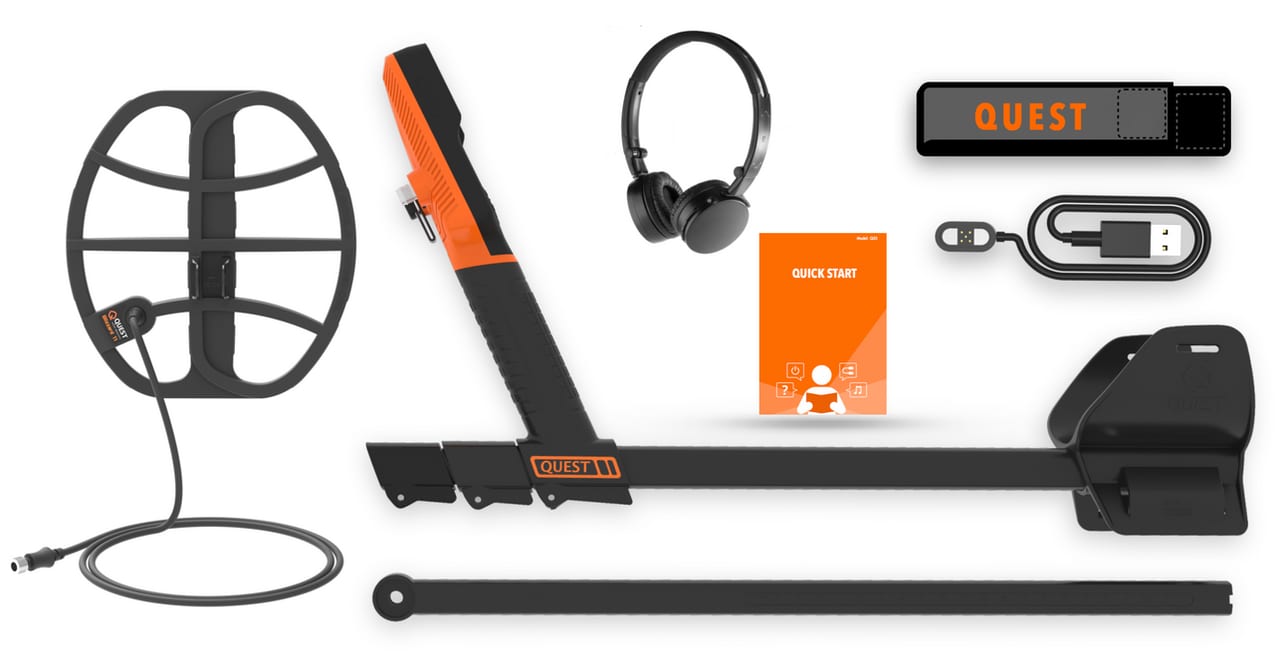 QUEST Q35 in de doos — schijf, bedieningskast, draadloze koptelefoon, armsteun, snelstartgids, USB-kabel en standaard